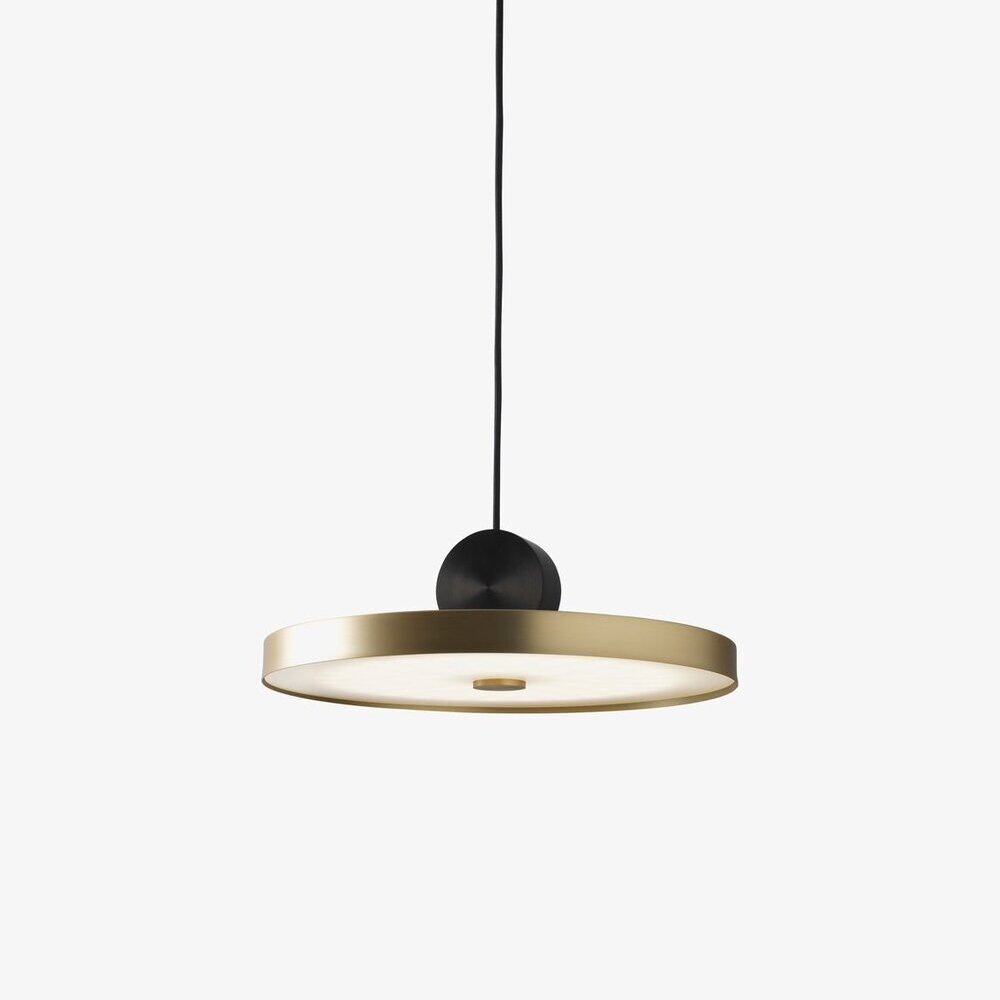 Modern restaurant featuring stylish pendant lights, lush greenery, and an inviting atmosphere with elegant table settings