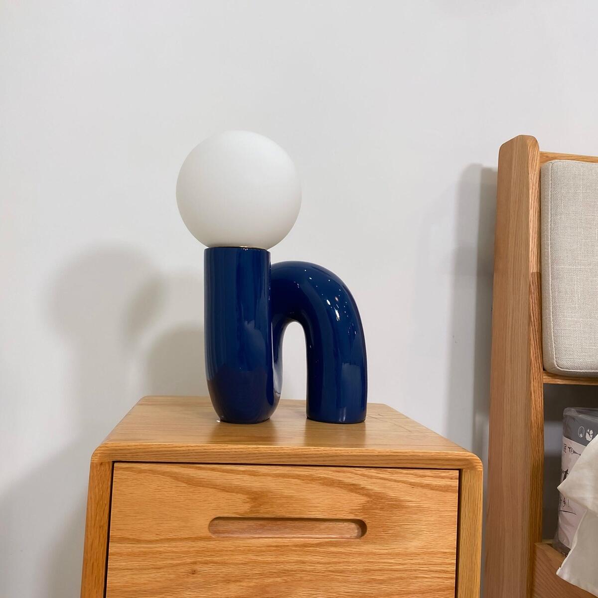 Contemporary Table Lamp with Voluminous N-Shaped Base