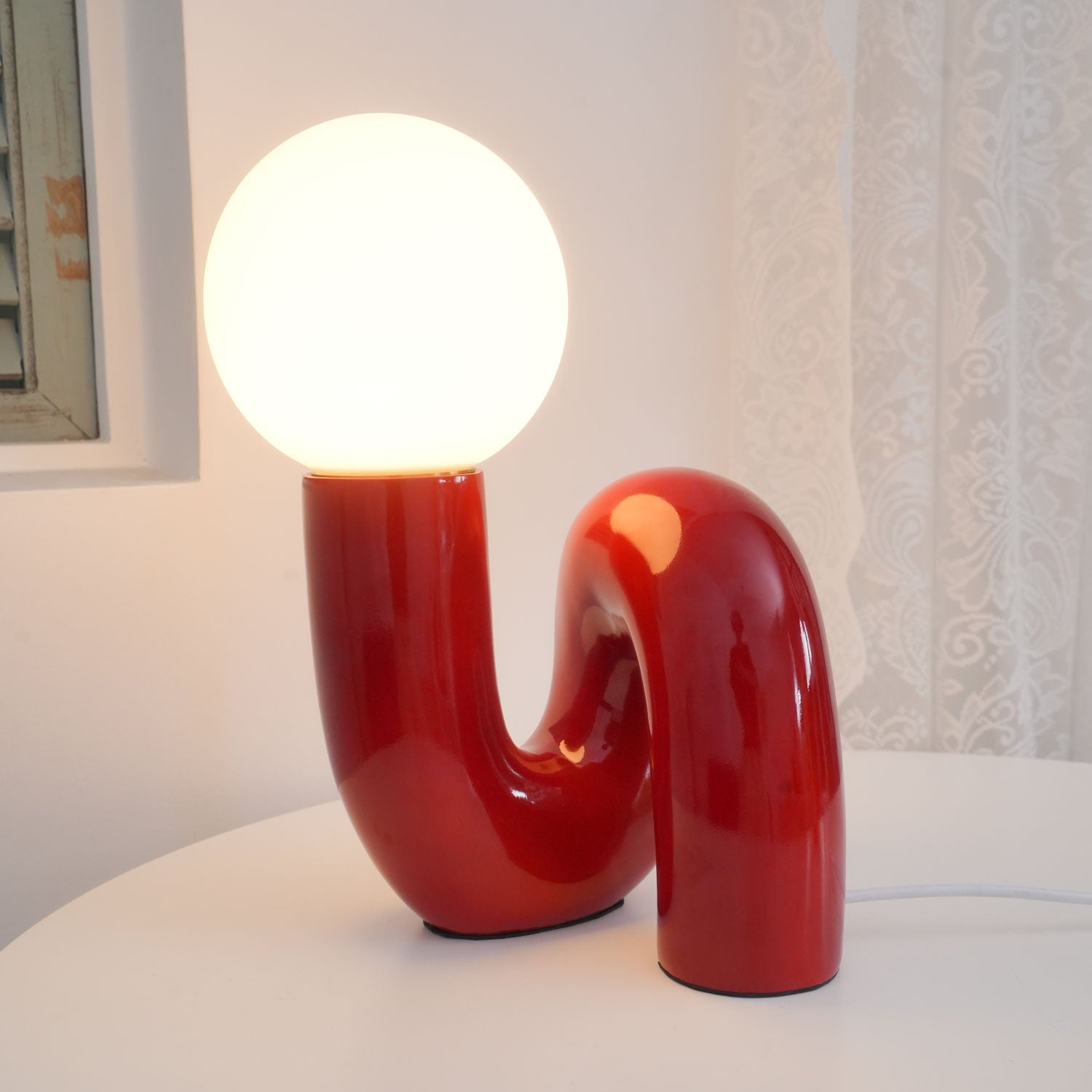 Contemporary Table Lamp with Voluminous N-Shaped Base