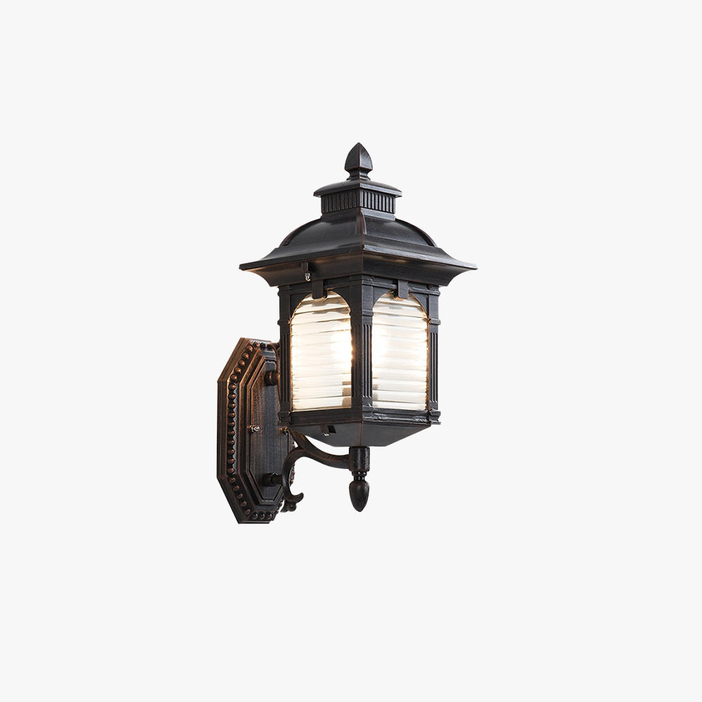 Vintage coffee-colored outdoor wall lantern made of metal and glass panels, ideal for courtyards, porches, and terraces. Durable, waterproof design for outdoor use.

