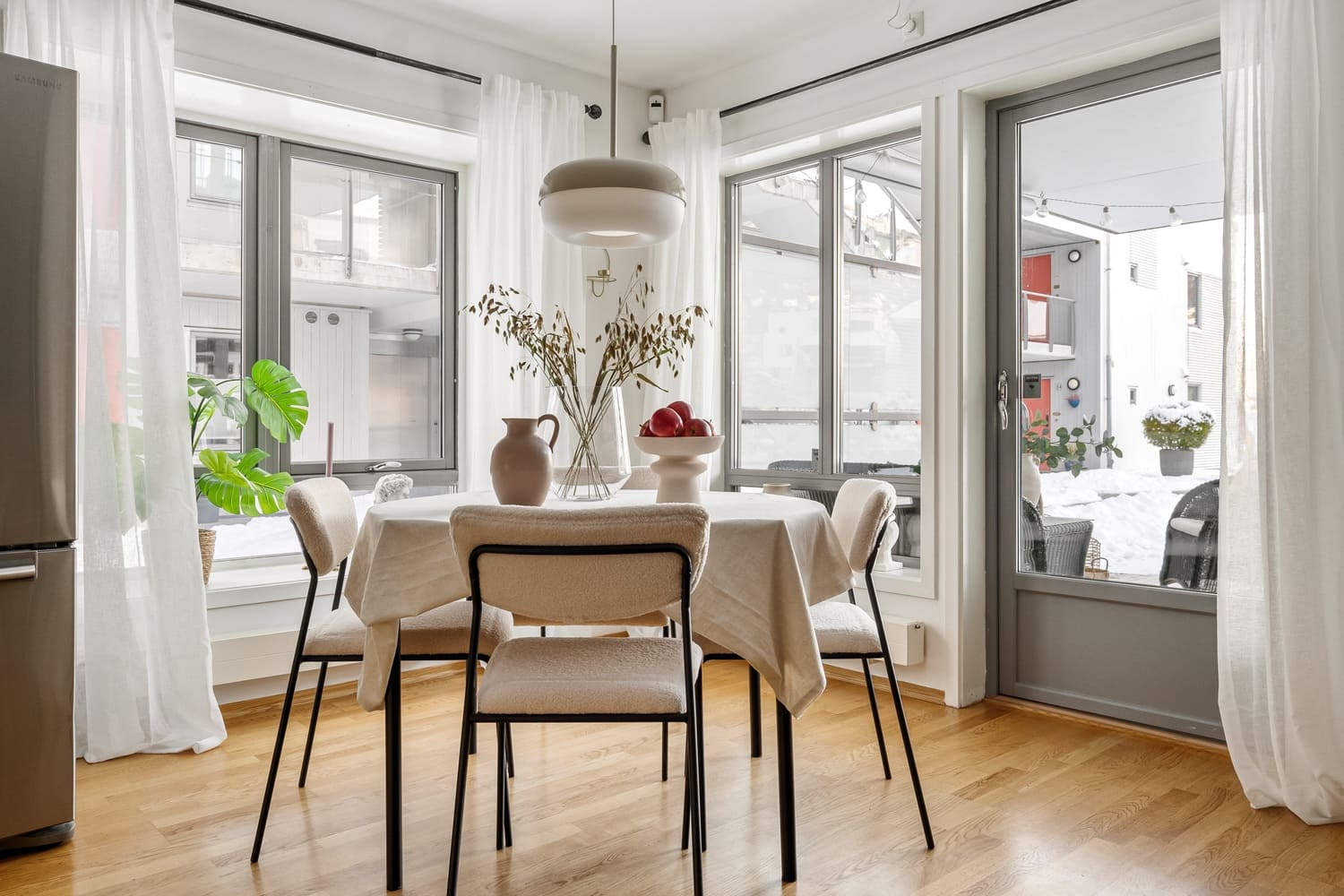 Bright dining room with custom lighting and minimalist decor.