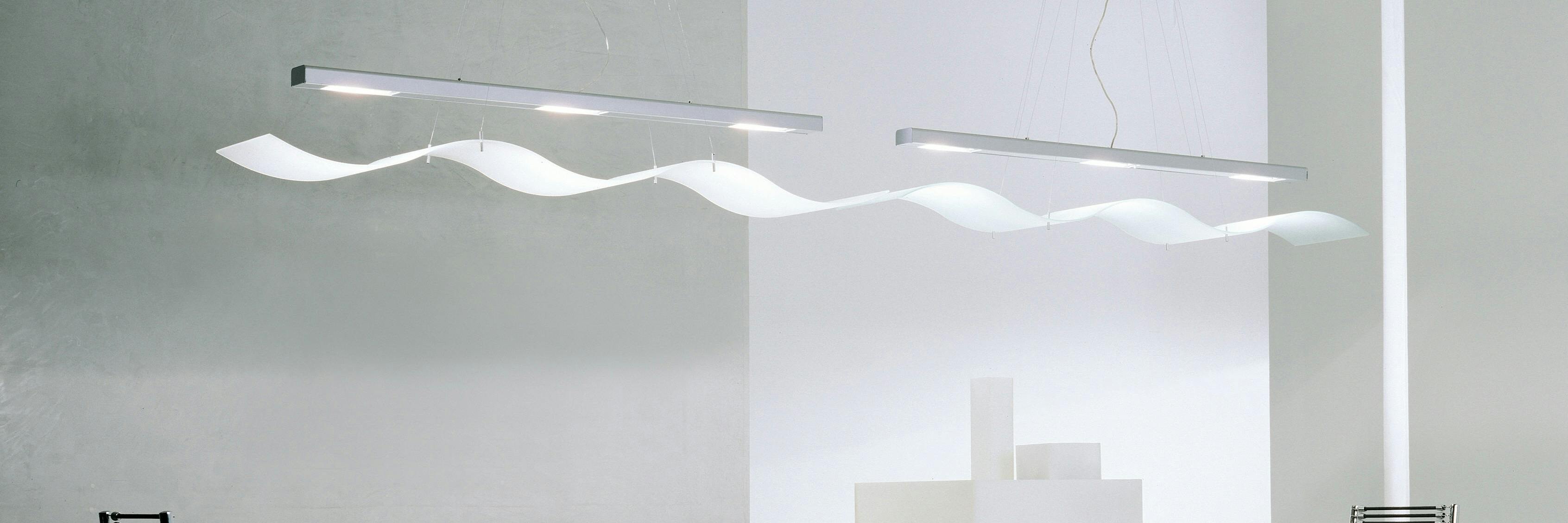 Hanging geometric LED pendant lights with a modern rectangular design, illuminating the room in soft white light.