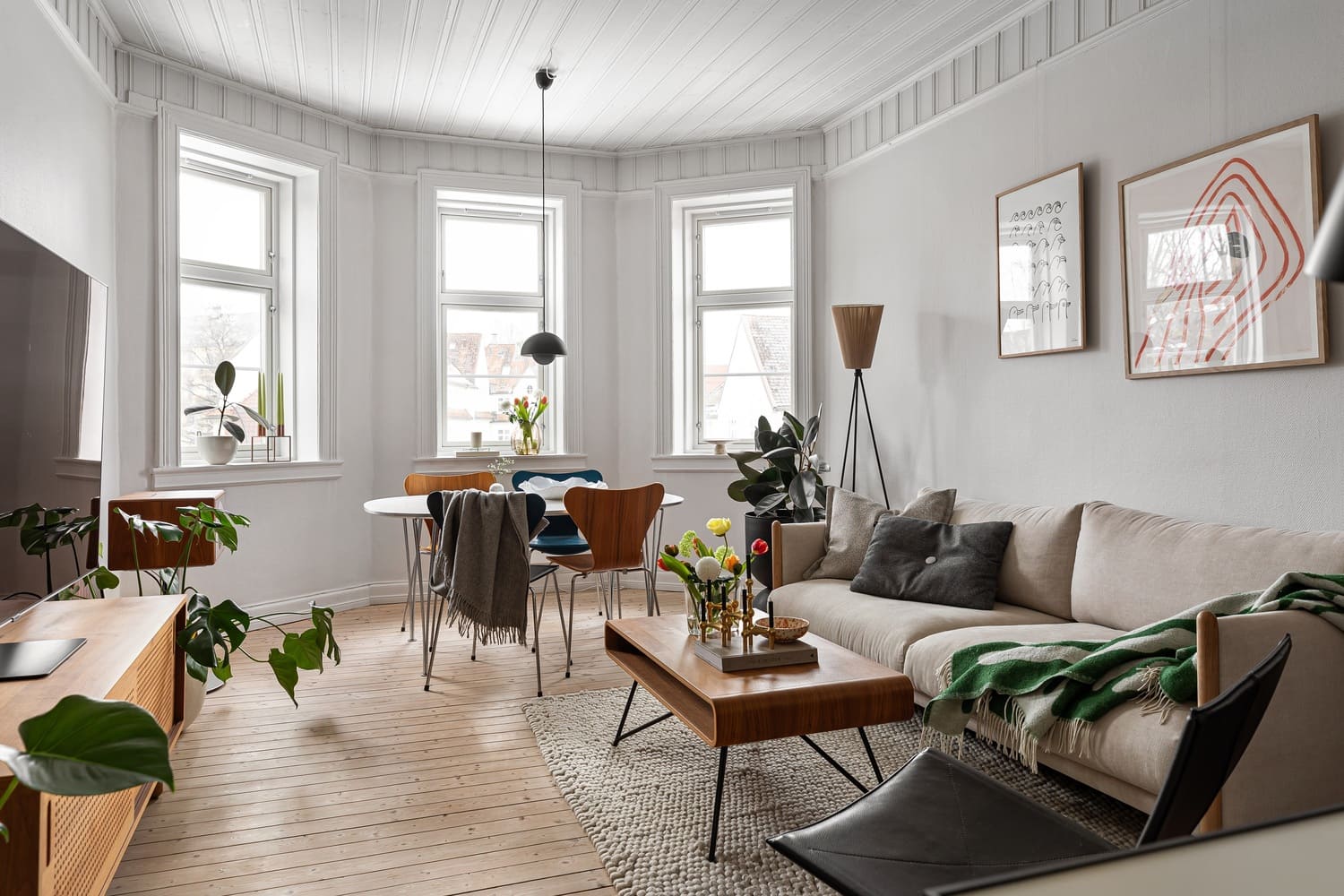 Modern living room with custom pendant lighting and minimalist decor.