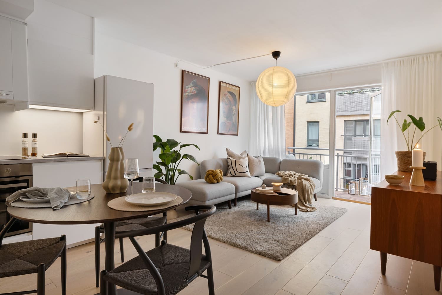 Open living space with modern custom lighting and neutral color palette.