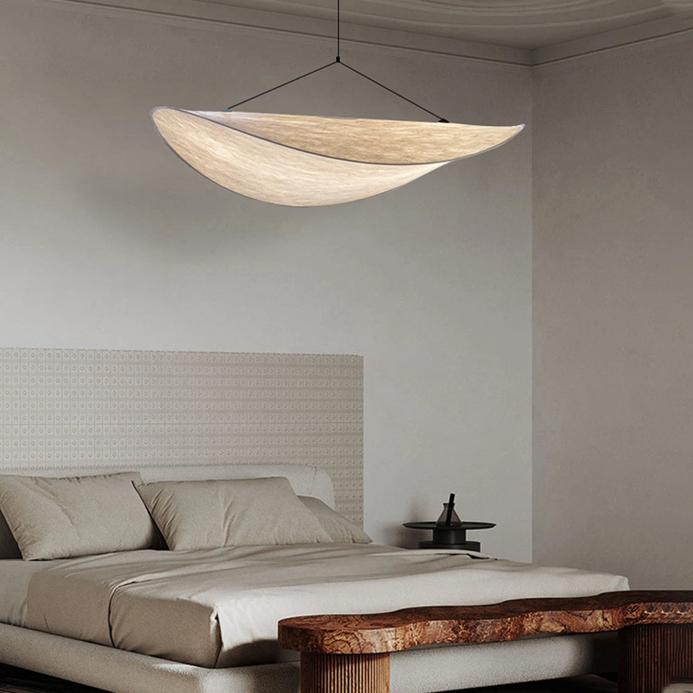 CloudGlo LED Pendant Light creating a serene ambiance in a modern bedroom with its soft, cloud-like design.