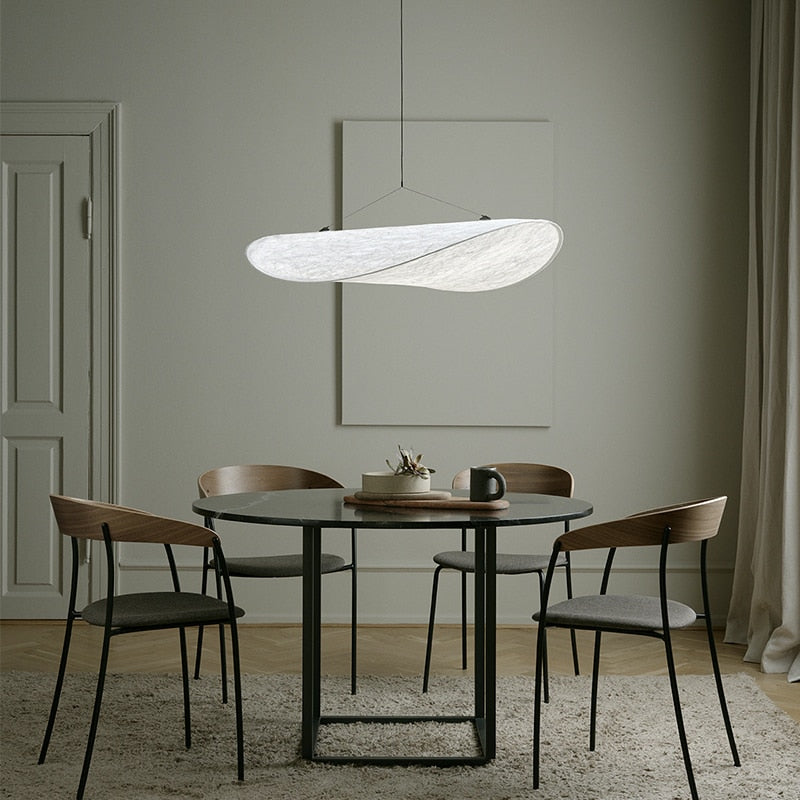 CloudGlo LED Pendant Light illuminating a modern dining room, adding a touch of elegance with its organic design.