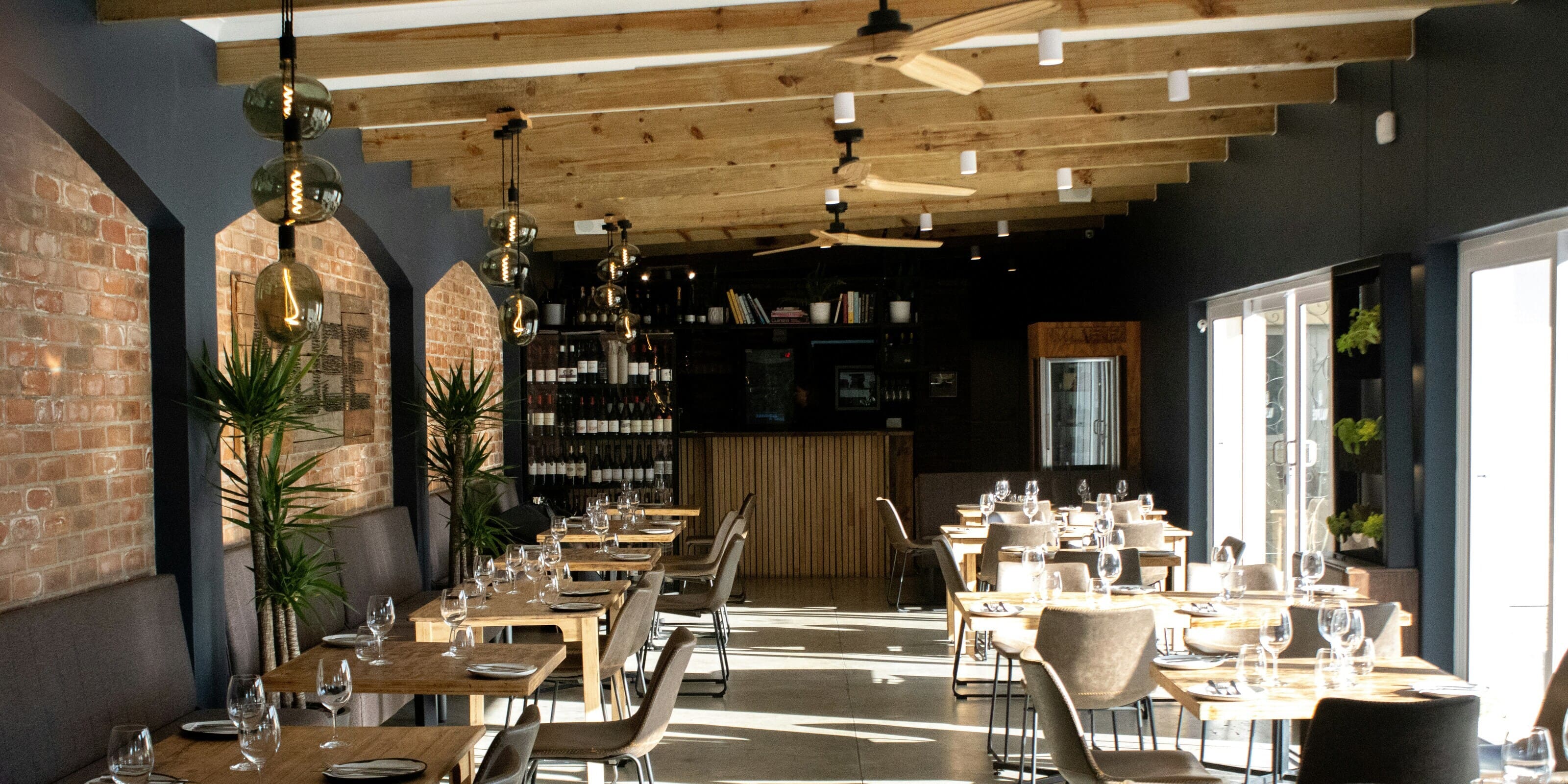 Restaurant lighting with wooden ceiling and stylish lamps for business.