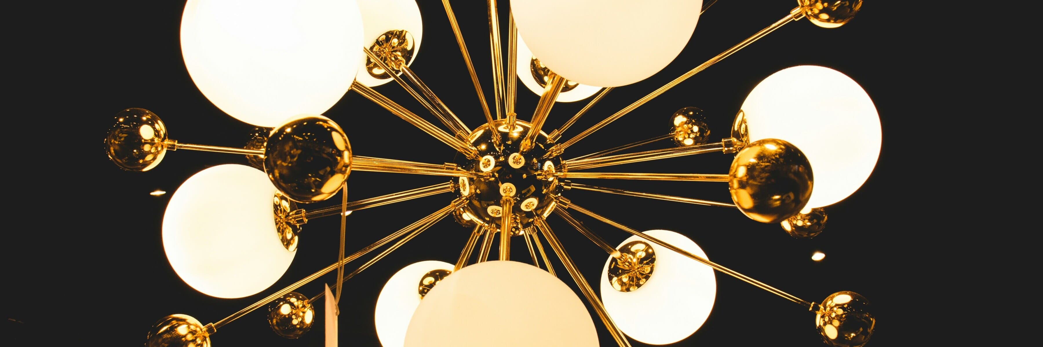 Sputnik-style chandelier with gold finish and orb-shaped lights, a trendy and elegant lighting option in the special offers collection.