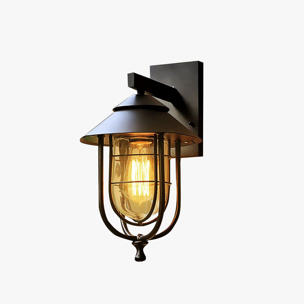 Vintage lantern-shaped metal outdoor wall lamp with glass panels, ideal for courtyards, terraces, and patios. Weatherproof and durable design, offering classic charm and elegance.


